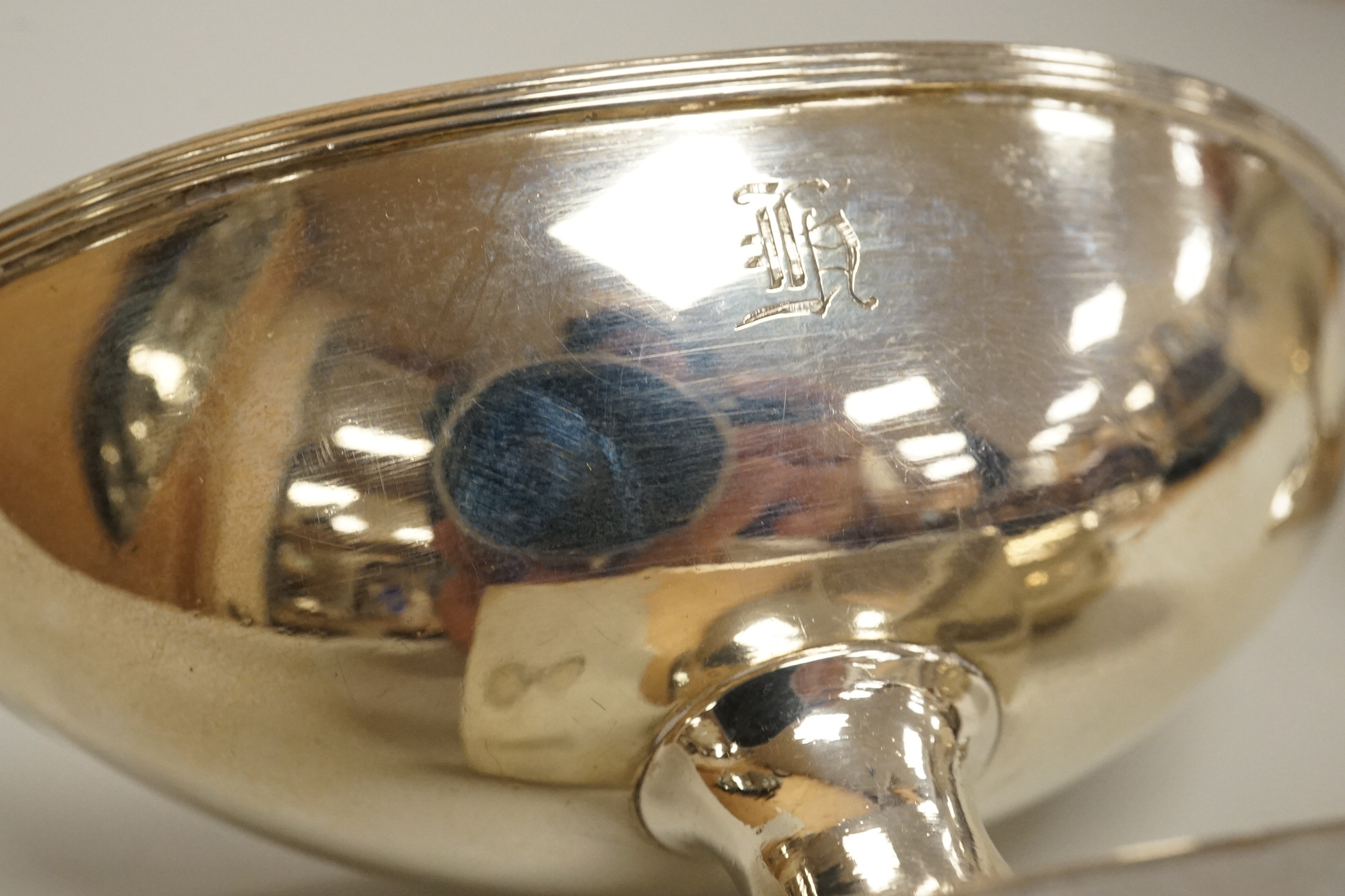A George III silver pap boat, maker ?? and EB, London 1812, length 12.1 cm, together with a pair of Georgian Scottish silver boat shaped pedestal salts, maker RG, gross weight 7oz.